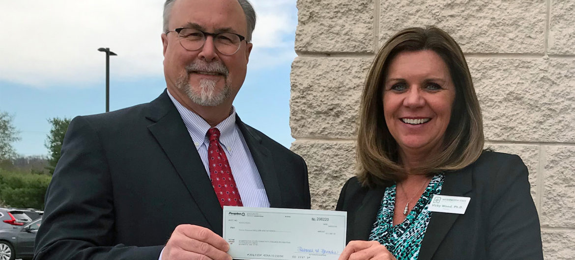 Peoples Bank recently donated $12,000 to the Washington State College of Ohio Foundation in support of scholarships. Shown are (from left to right) WSCO Board of Trustees member Randall Barengo and WSCO President Dr. Vicky Wood accepting the contribution.